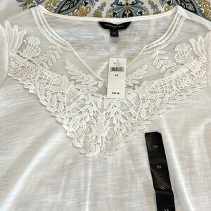 Beautiful breathable white blouse with lace collar.  3/4 sleeves Size XS